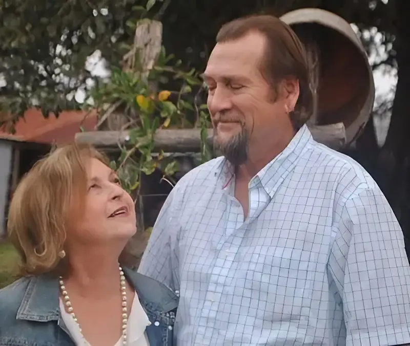 A man and woman standing next to each other.