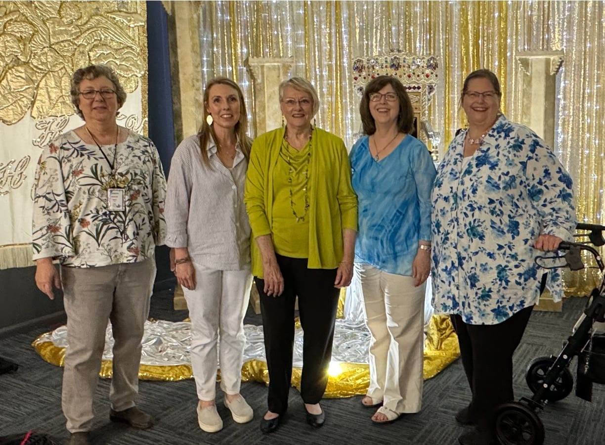 A group of women standing next to each other.