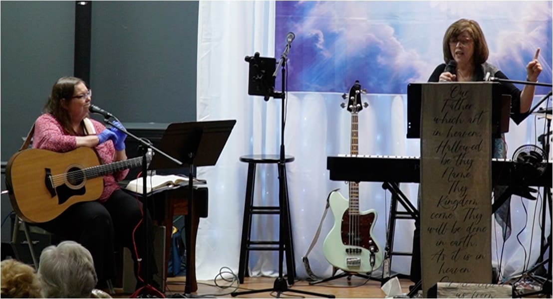 A room with musical instruments and a guitar.