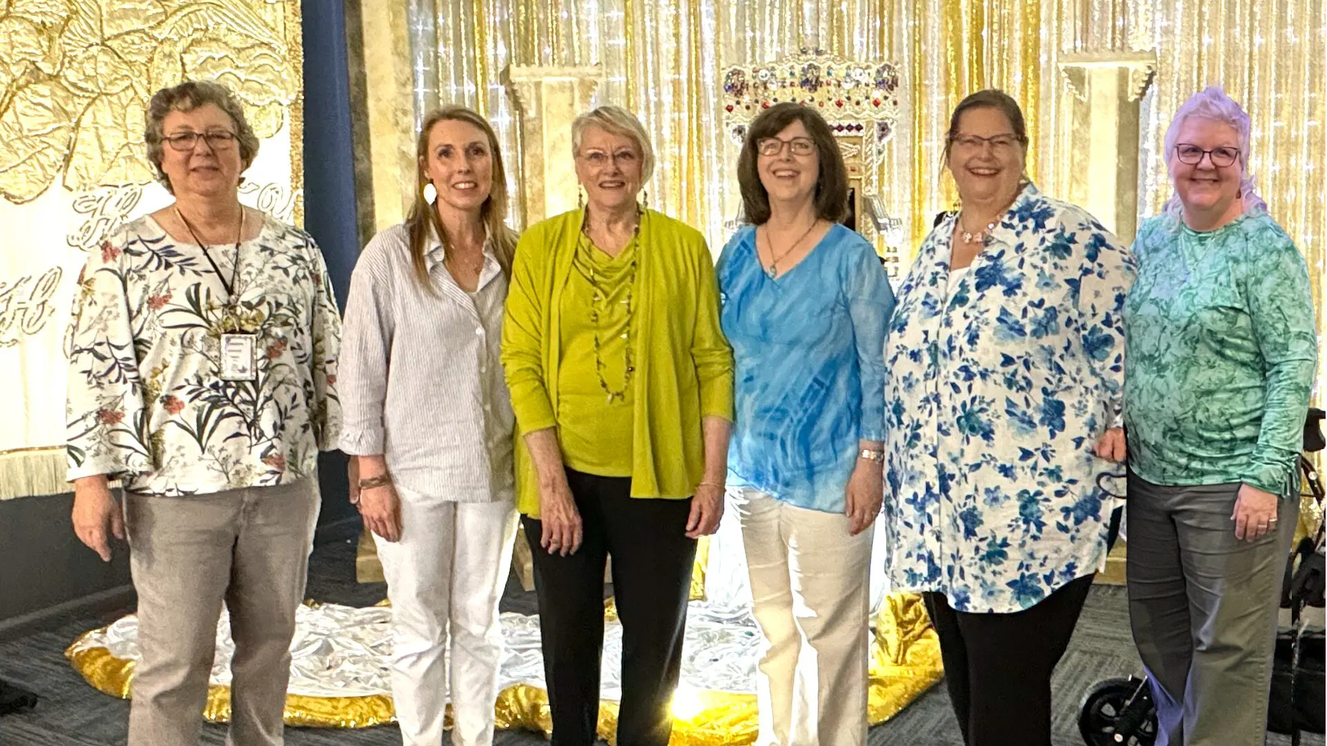 A group of women standing next to each other.